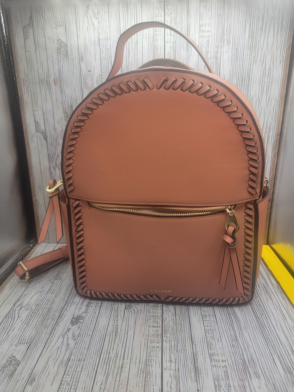 Calpak Kaya Whipstitched Faux Leather Round Backpack- Blush Pink With Gold Tones